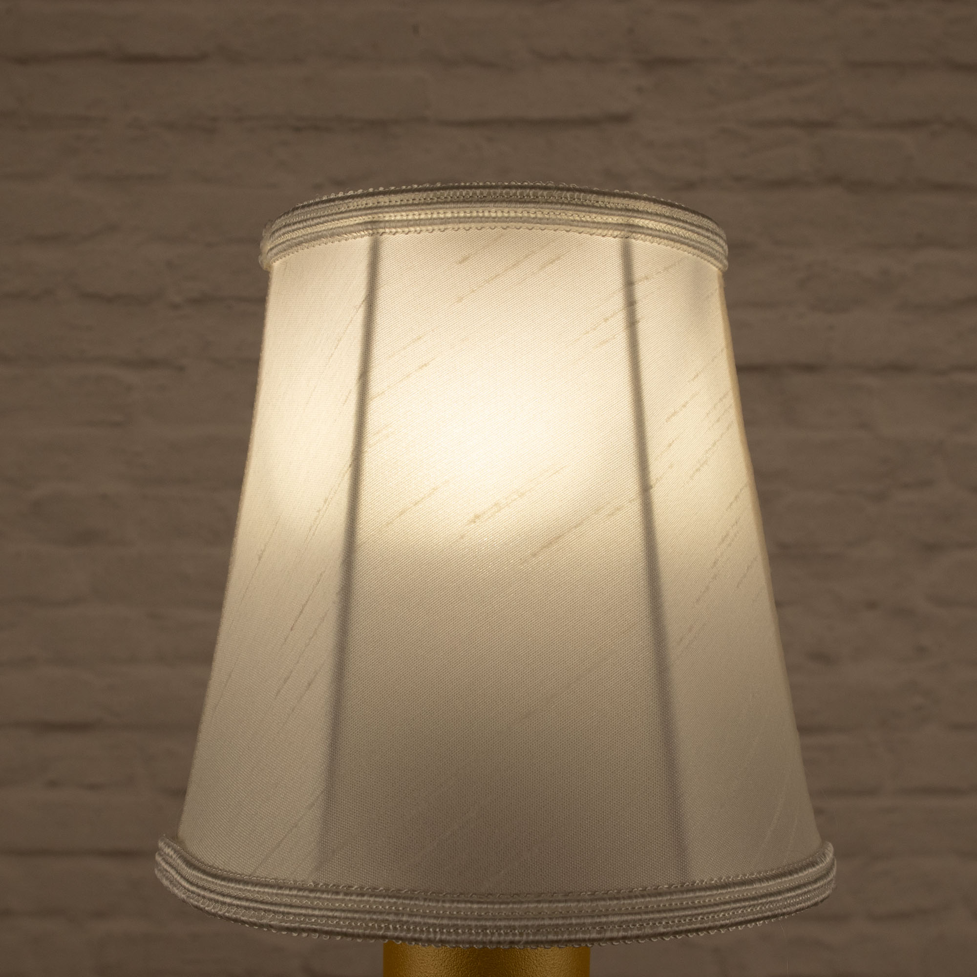 Lit white empire faux silk chandelier shade with matching soutache trim